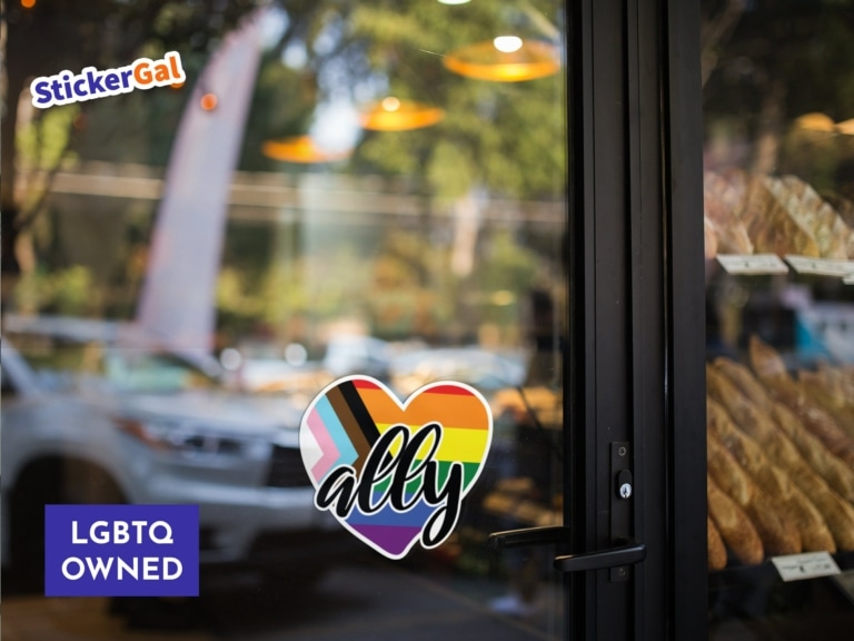 Welcoming LGBTQ+ Straight Ally Heart Sticker Displayed on glass bakery front door